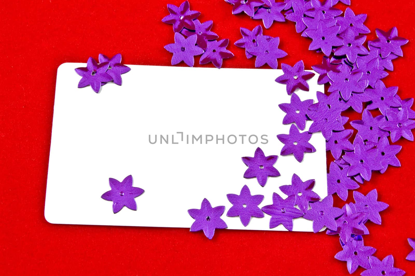 white card and violet stars on red background 