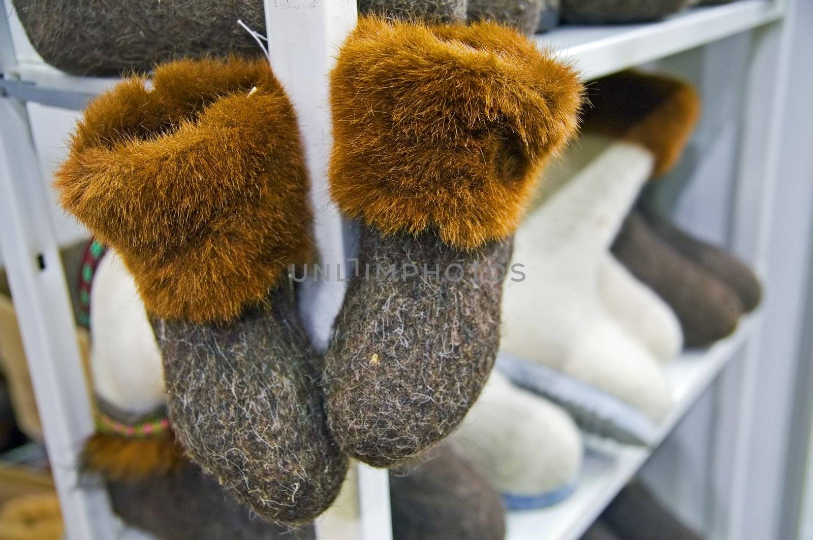 Traditional Russian felted shoes on shelf