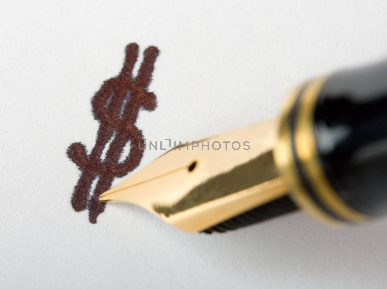 close-up gold pen writing dollar sign