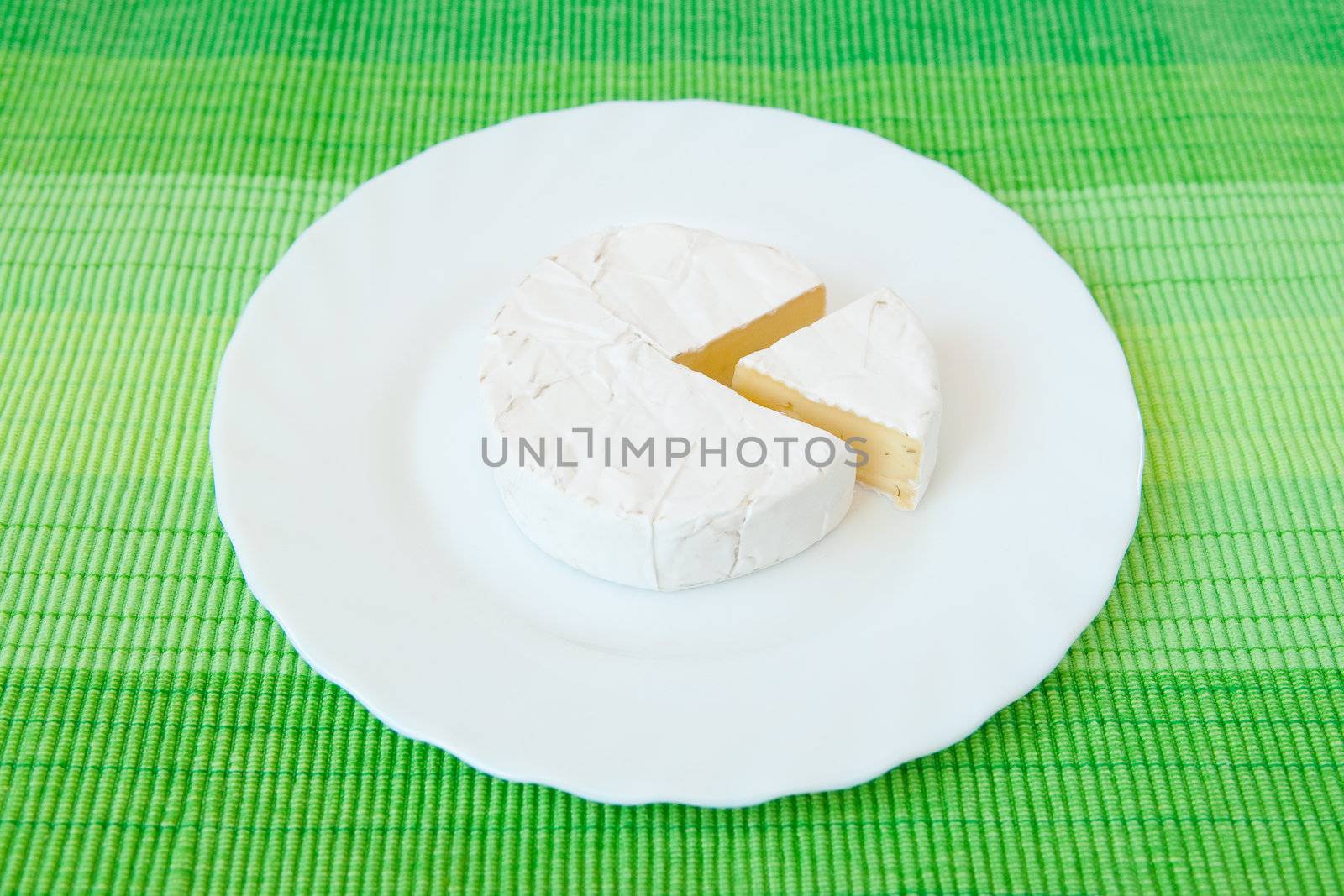 A blue cheese on the white plate