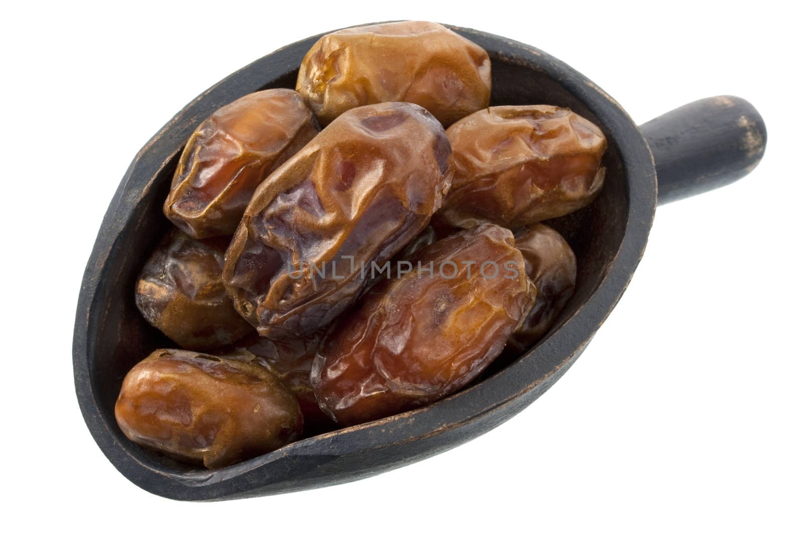 dried medjool dates on a rustic, wooden scoop, isolated on white
