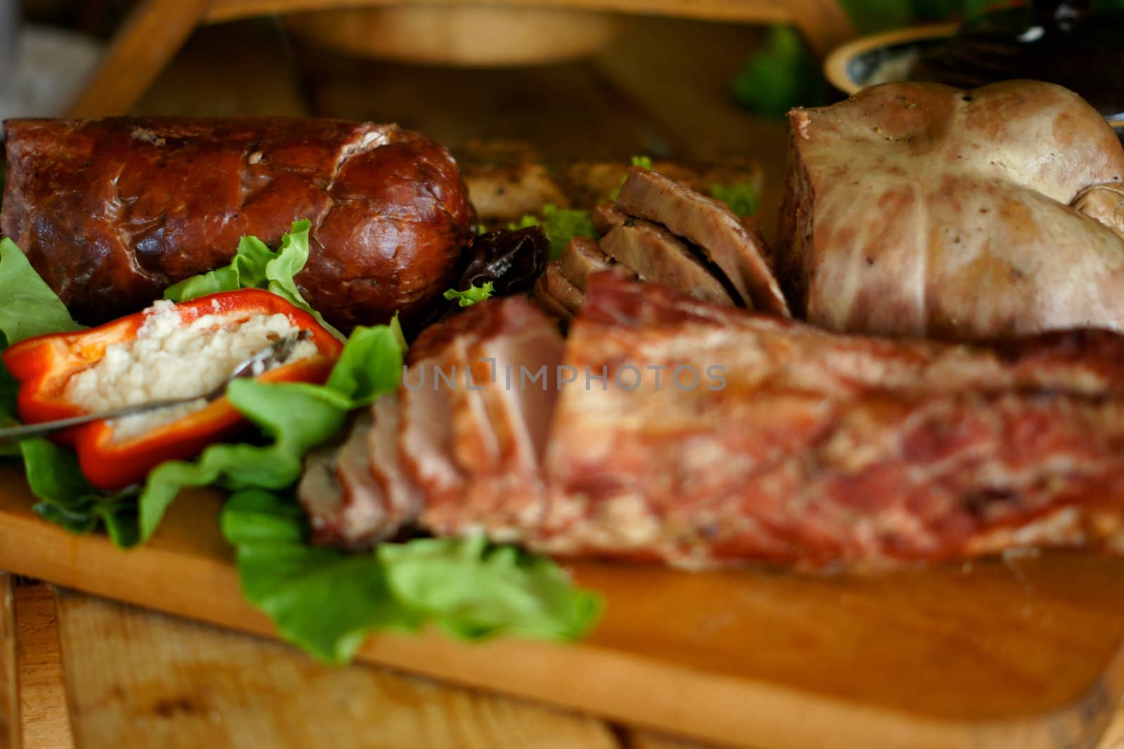 farmhouse table with traditional Polish delicacies. Ham, sausage, bread, etc.