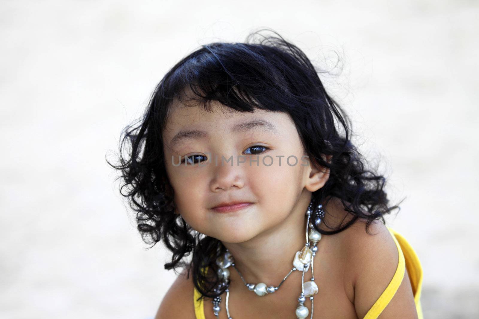 Portrait of the beautiful small Asian girl. Indonesia. Java