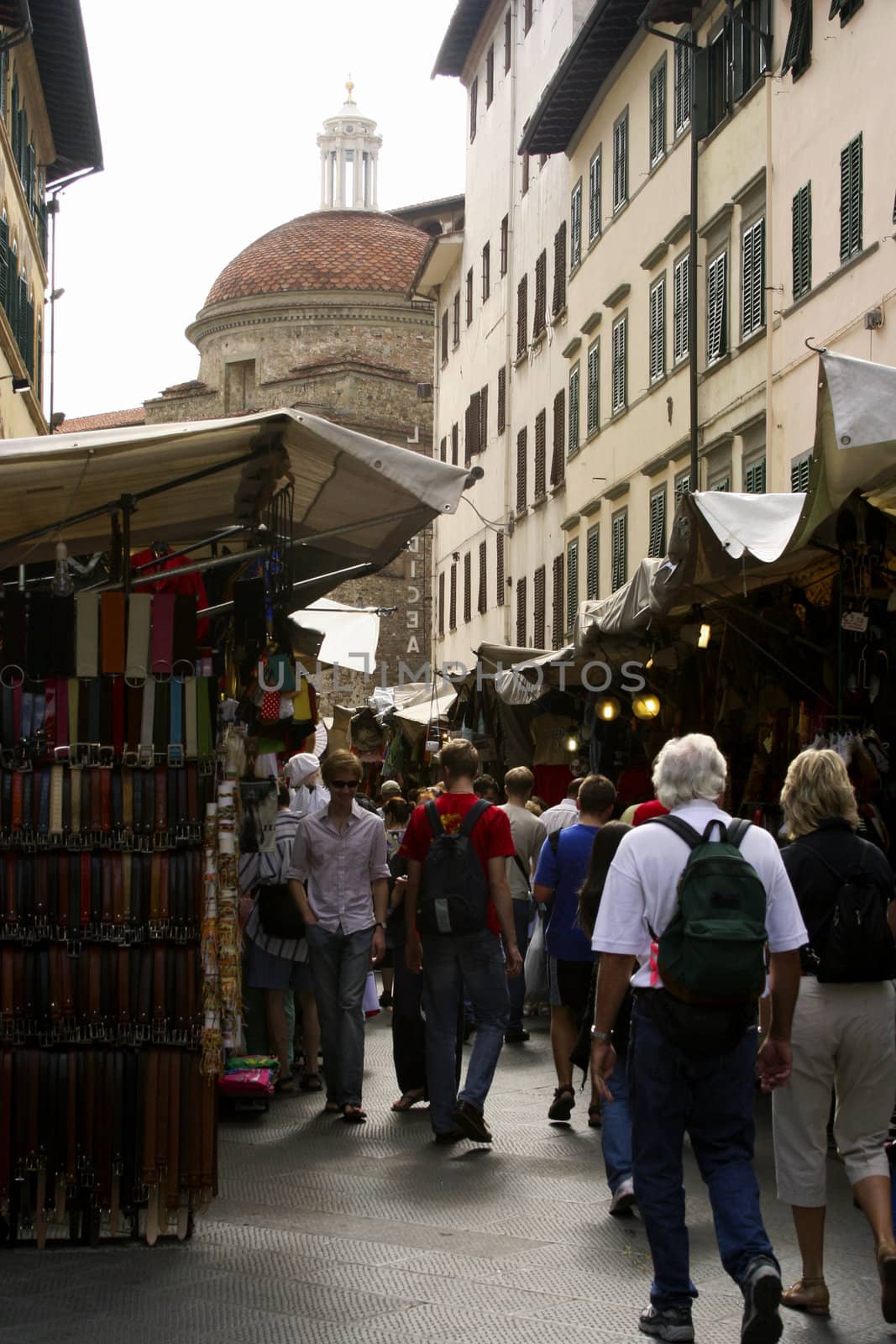 Shopping in an open marketplace in the shadow of the Duomo in Florence, Italy