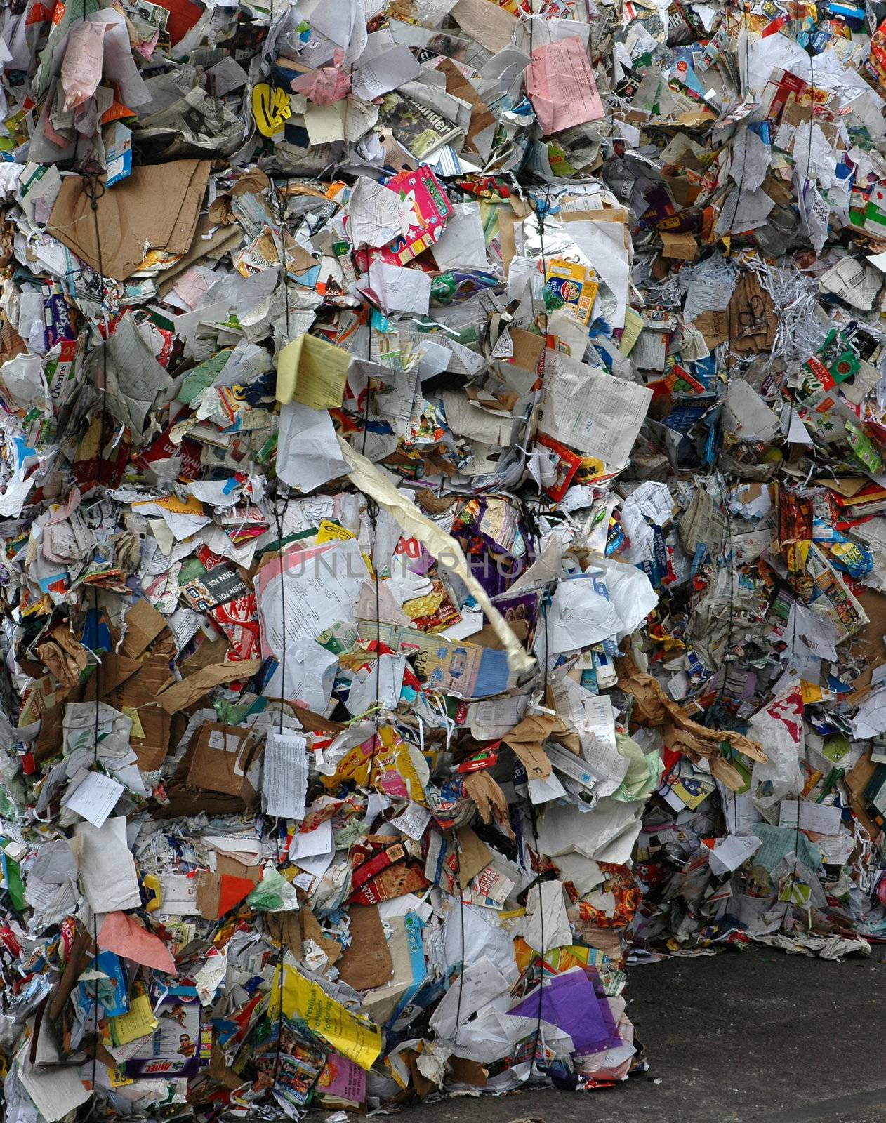 Stack of paper waiting to be recycled at recycling plant
