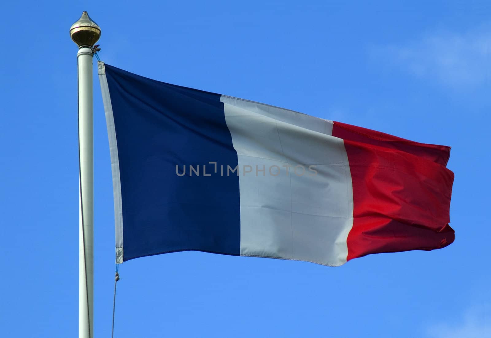 The flag of France flying on a flagpole