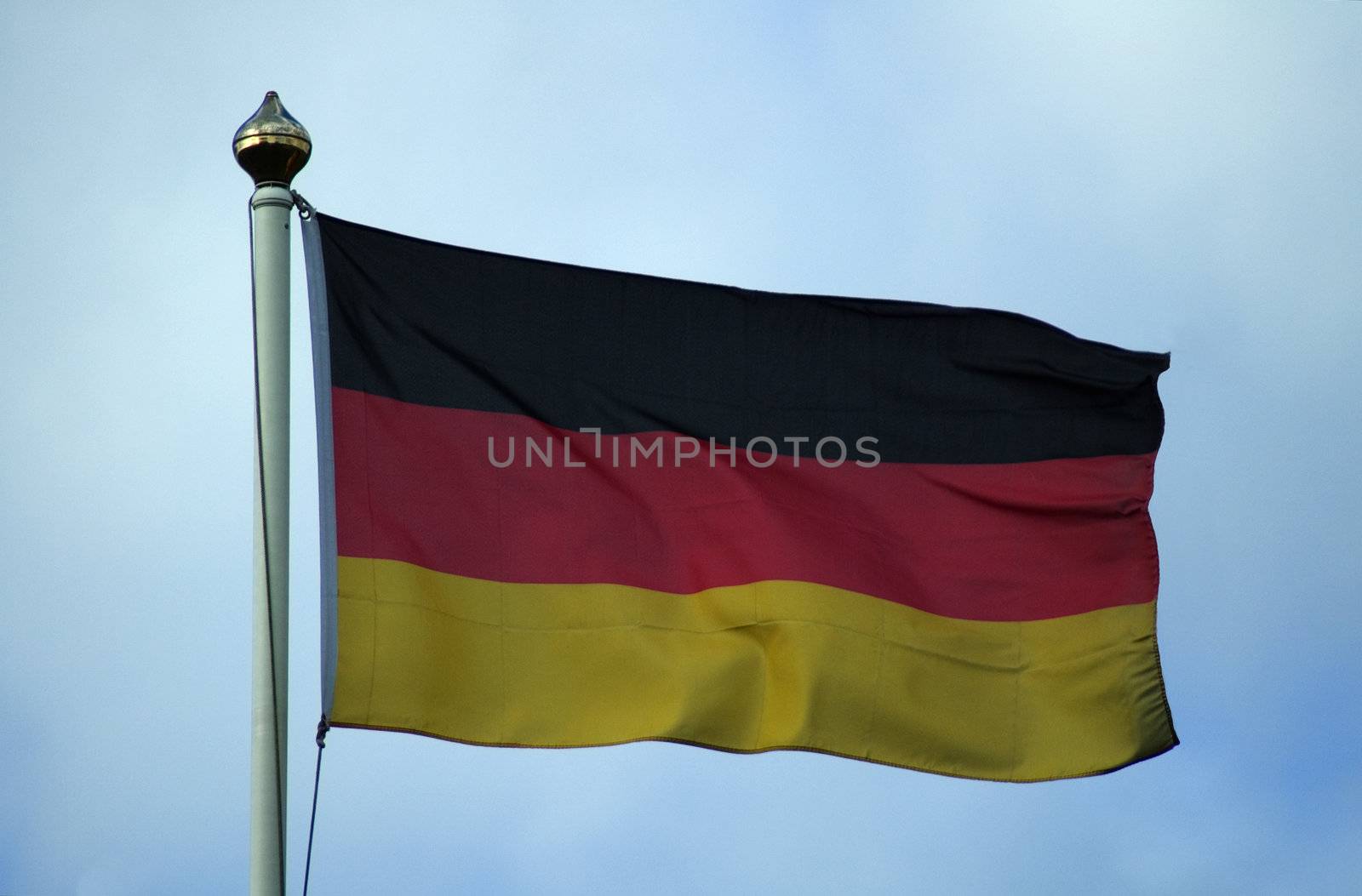 Flag of Germany flying on a flagpole