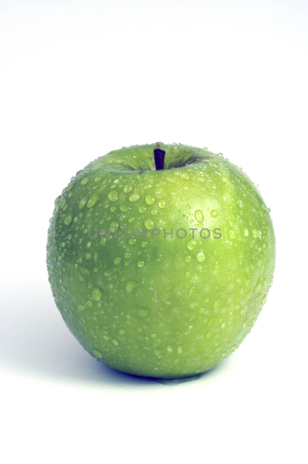 Granny Smith Apple with water mist and droplets on white background