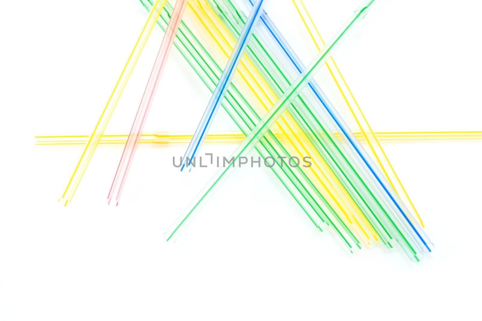 Plastic straws for cocktail on white background