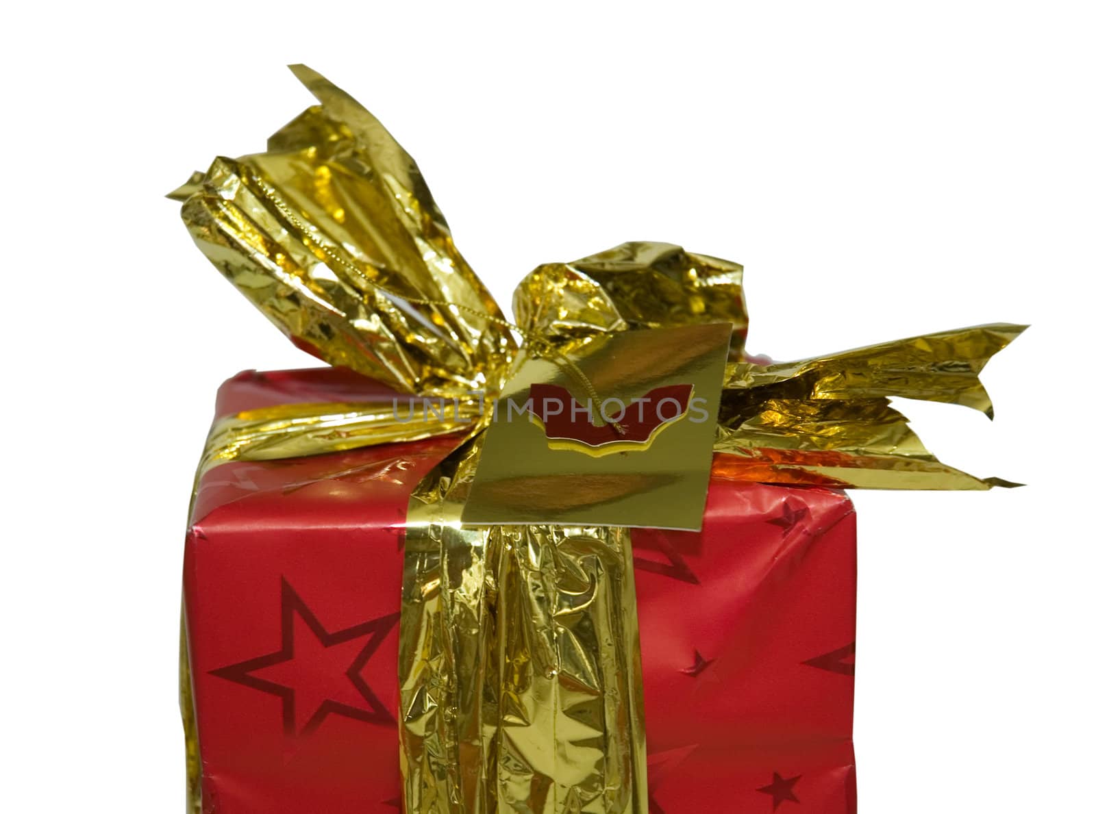 Close up of the top of a Christmas present wrapped in gold ribbon