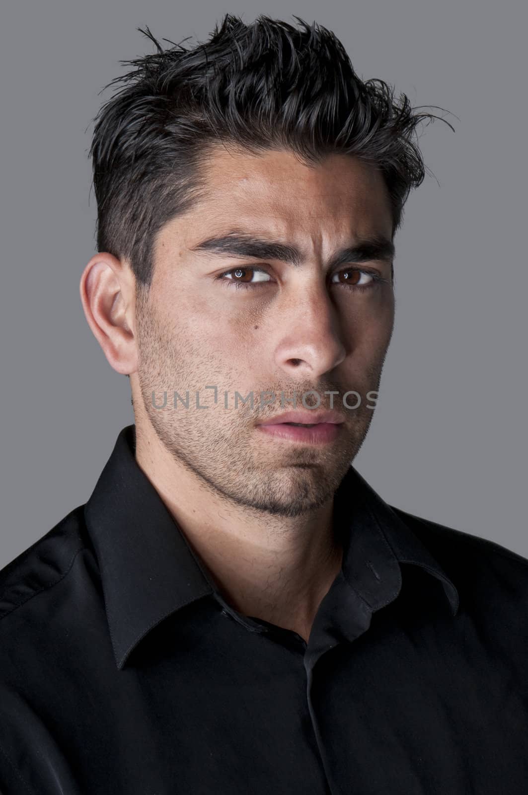 Portrait of young attractive hispanic man.
