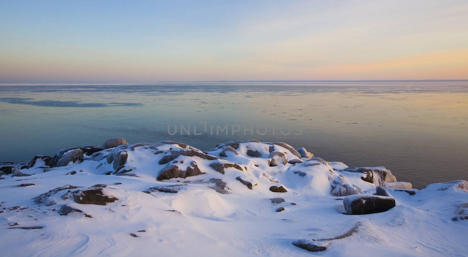 December image of lake Superior at sunset from Brighton Beach in Duluth, Minnesota