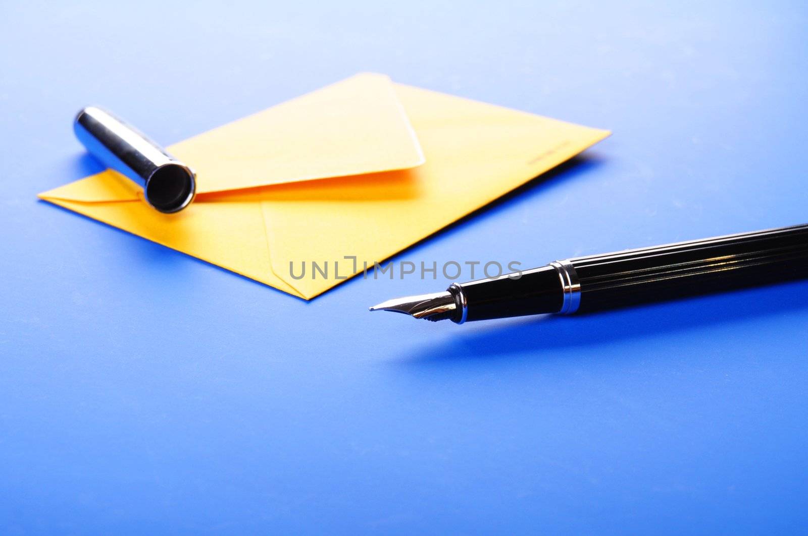 envelop and pen showing mail or communication concept