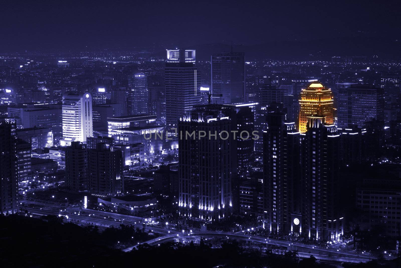 In Taipei lonely night, only one building has orange loght at purple city.