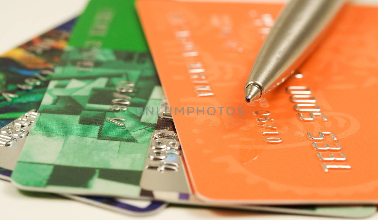 Pen on credit cards. Shallow depth of field. Financial background