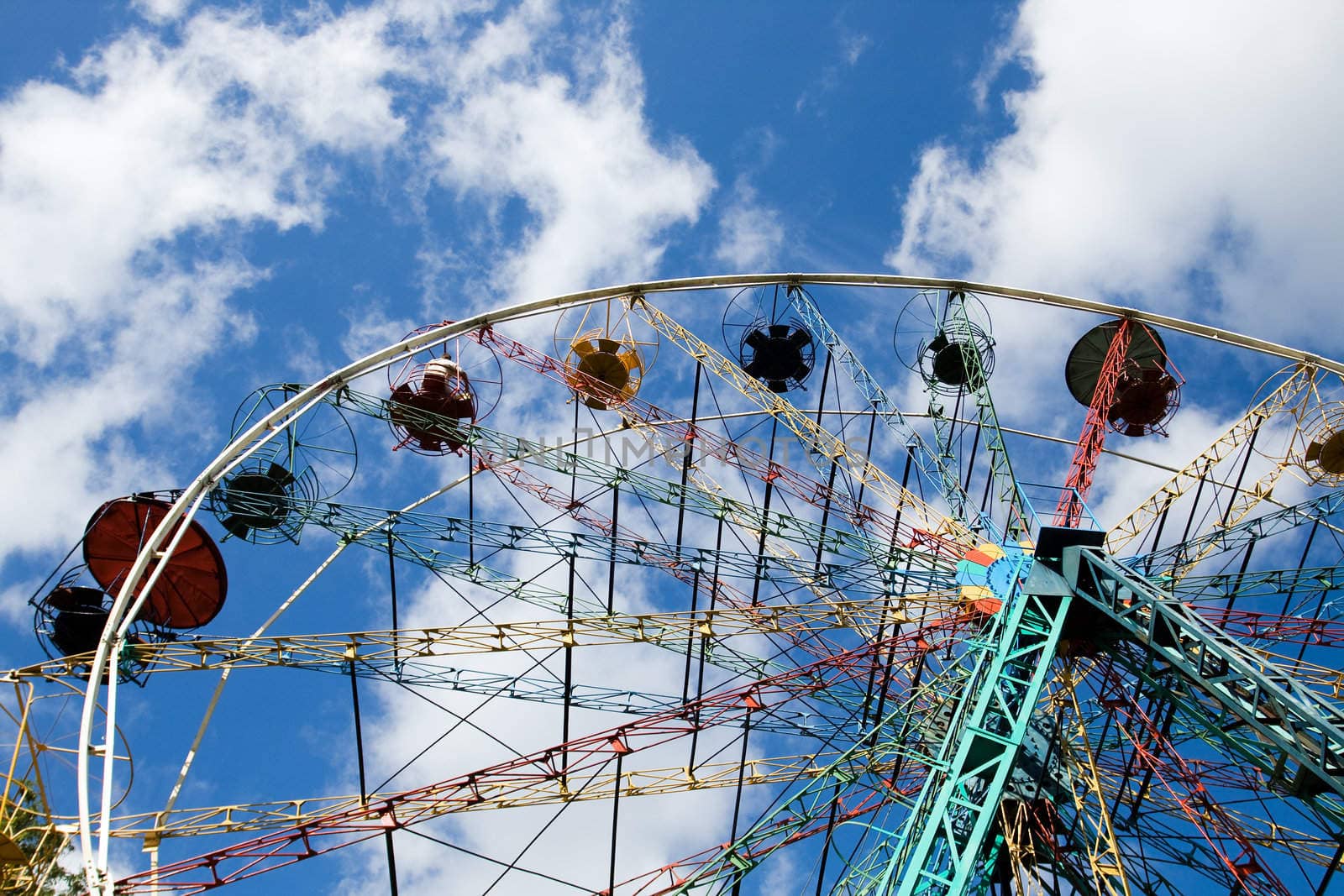 Multicoloured Ferris wheel against blue sky in Sigulda, Latvia