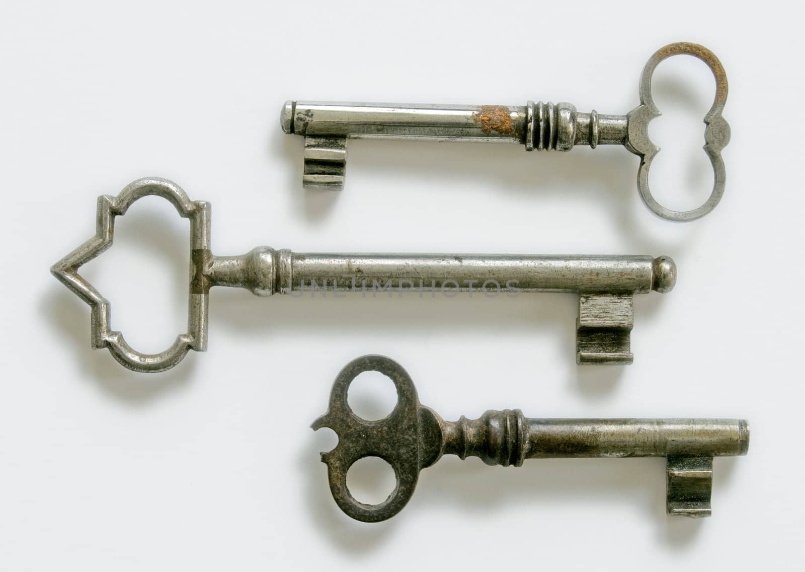 three vintage keys  isolated at white