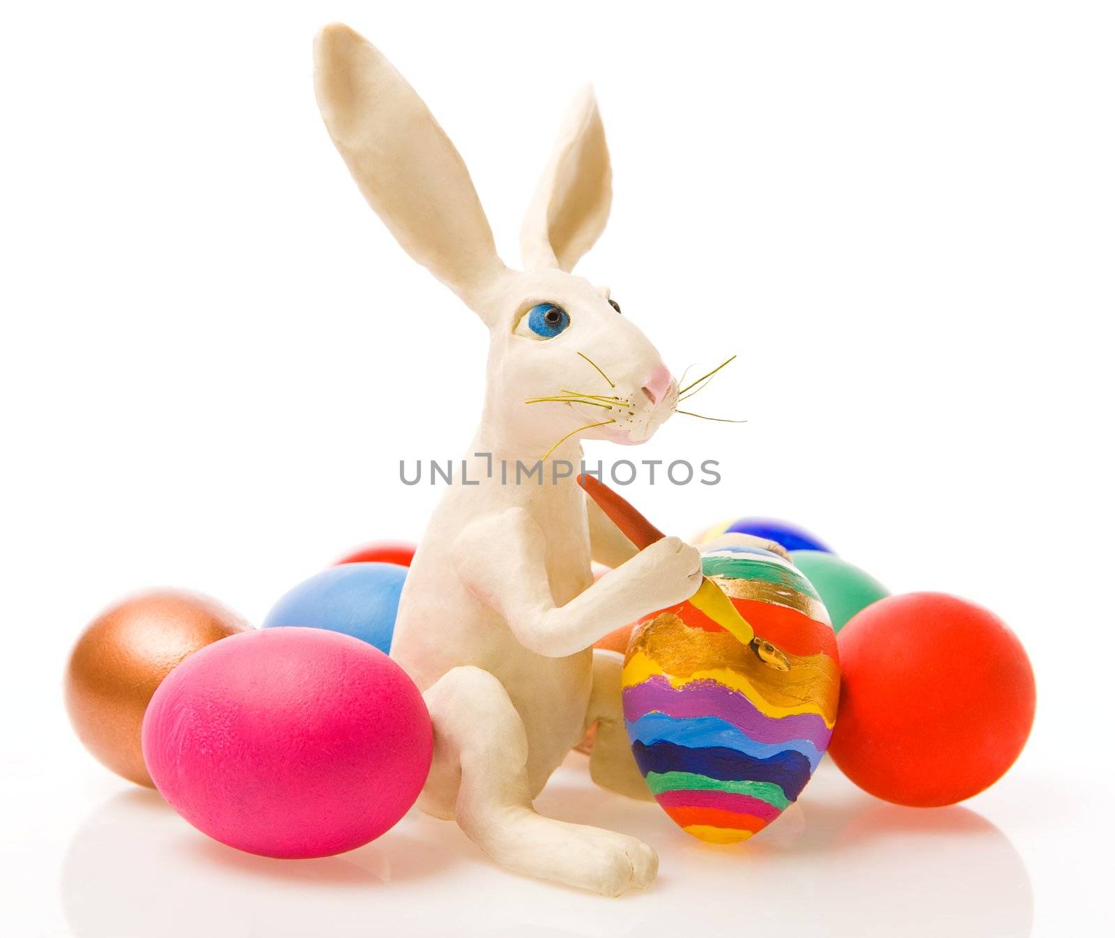 The white rabbit paints egg 
