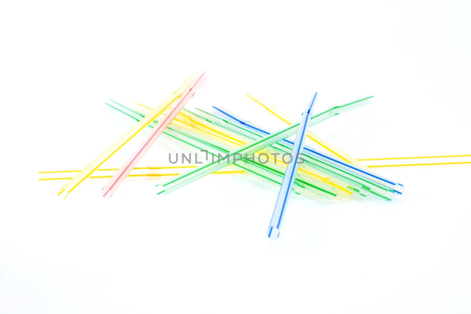 Plastic straws for cocktail on white background