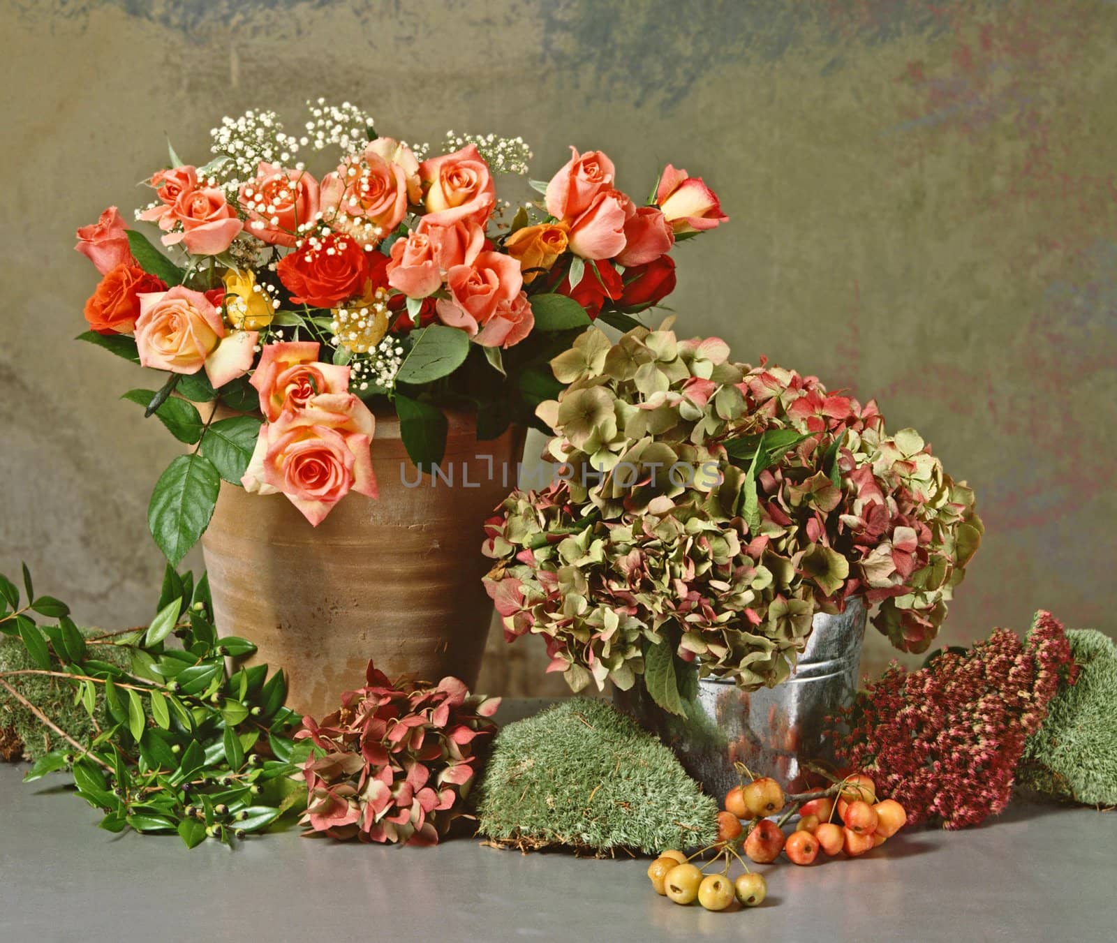 still life with a bunch of roses and dry hortensias