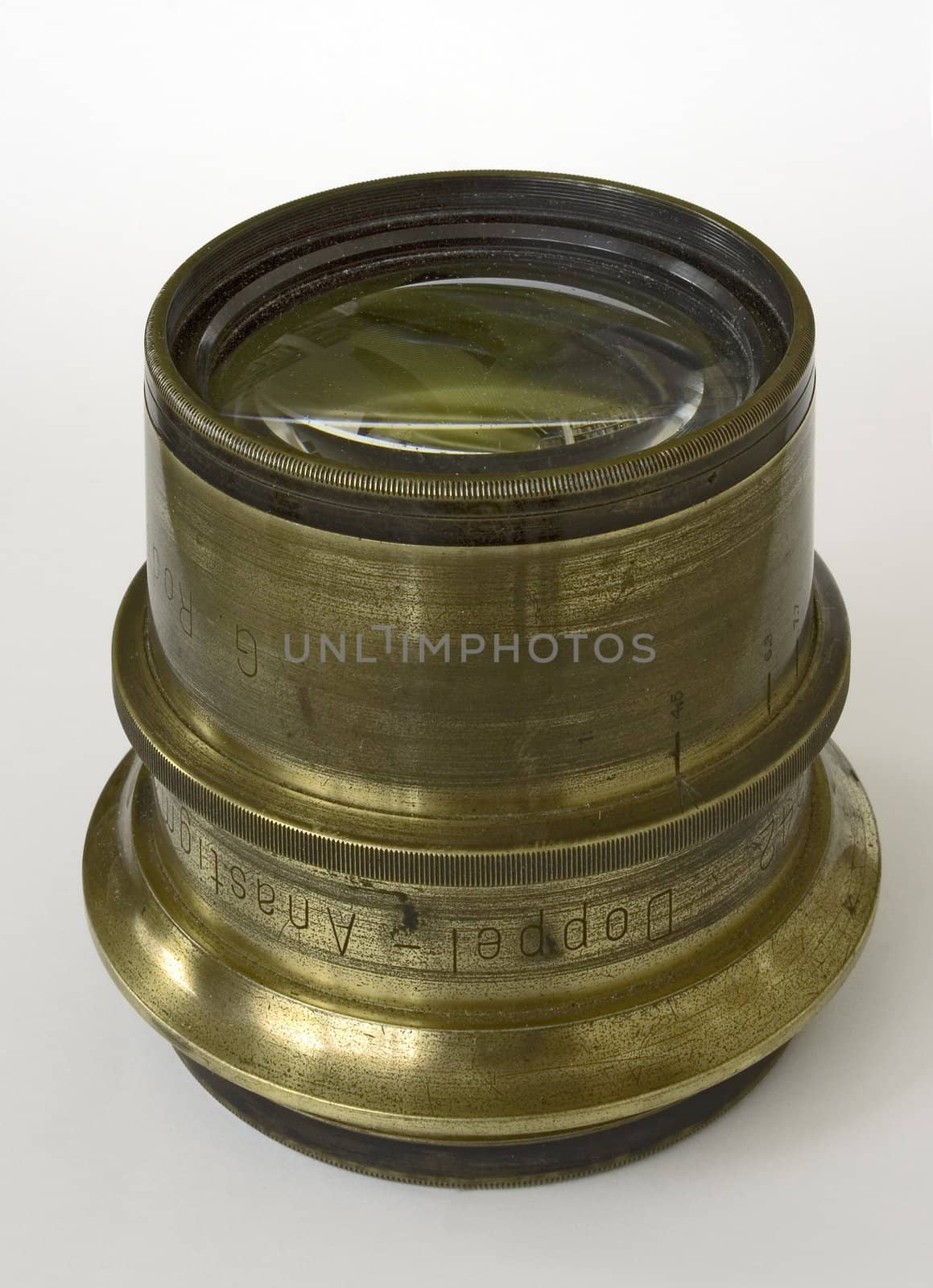 vintage brass lens isolated in white