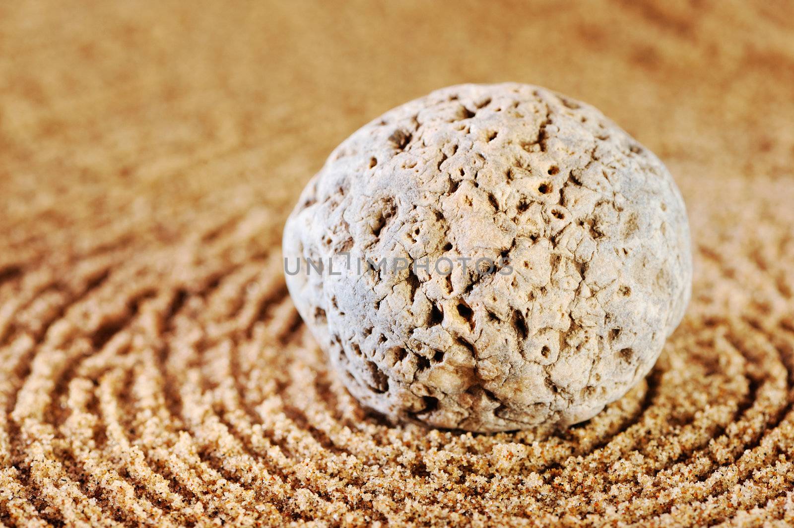 Sea sand and stone in the summer morning on a beach