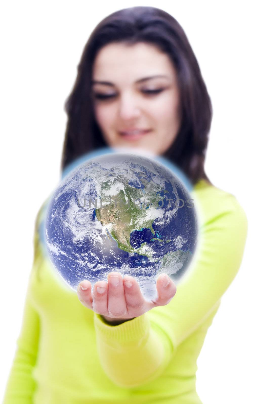 Conceptual image of the world in the hand of a woman with DOF