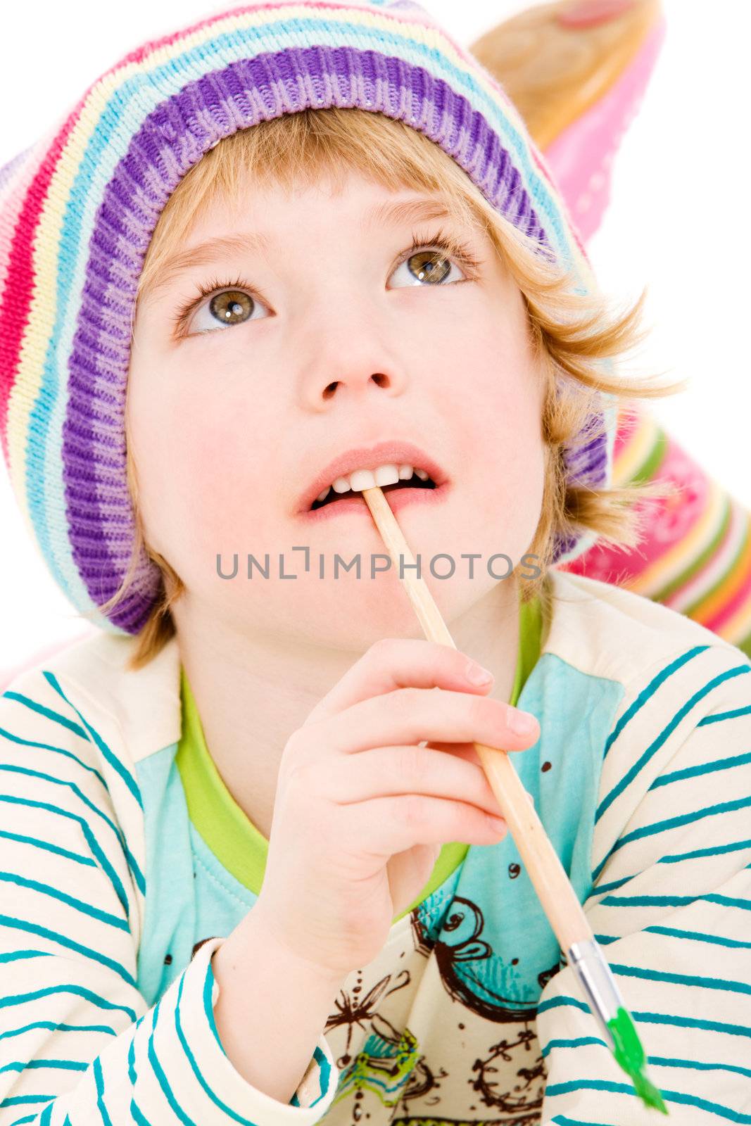 Portrait of young child painting on isolated white