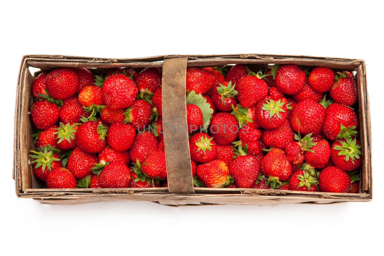 Fresh strawberries in the wicker basket