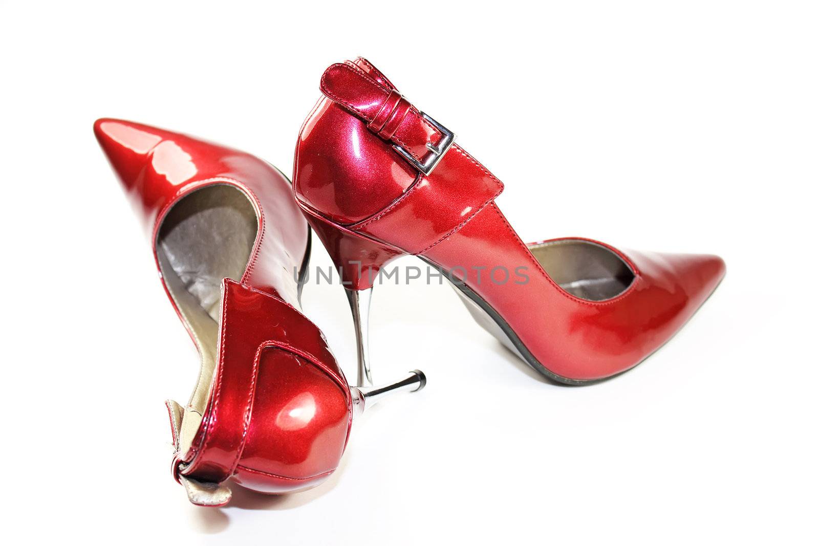 Elegant red high heels isolated on white background