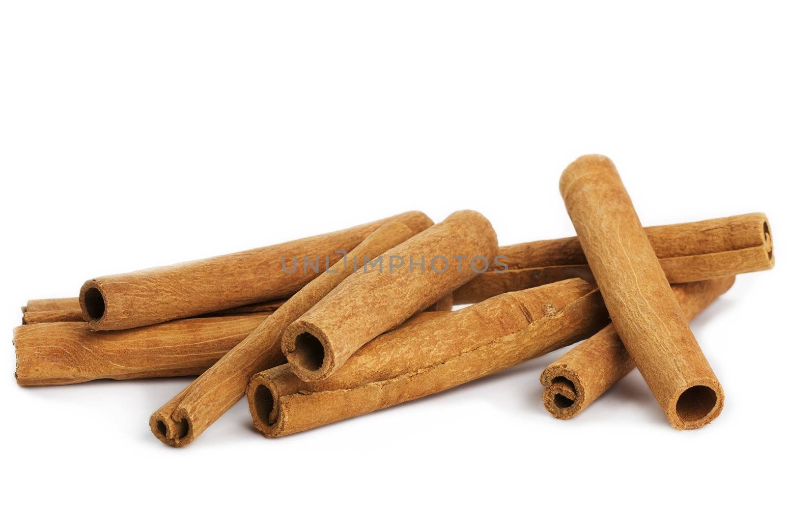 some cinnamon sticks on white background