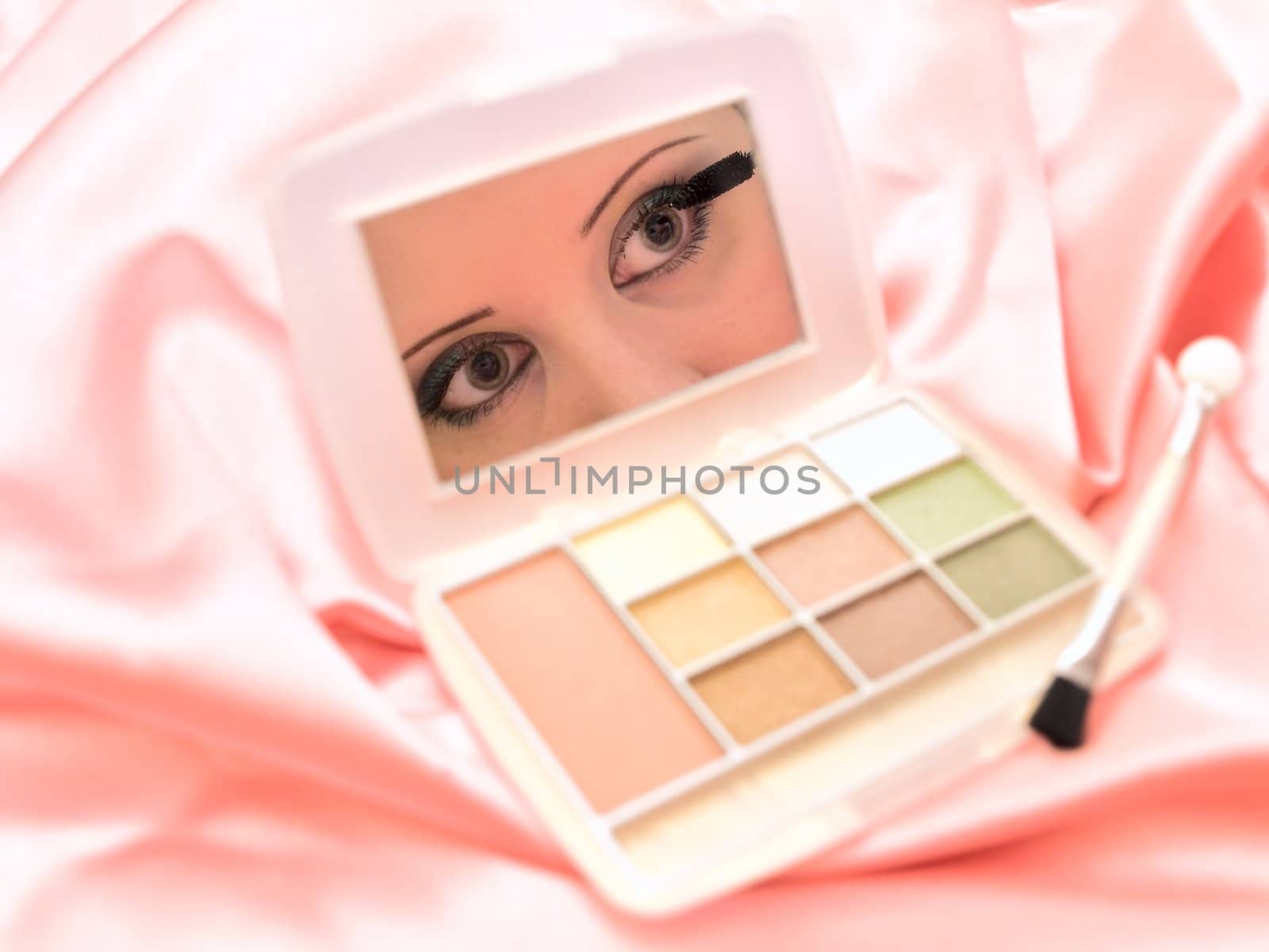 women eyes reflection in small mirror 
