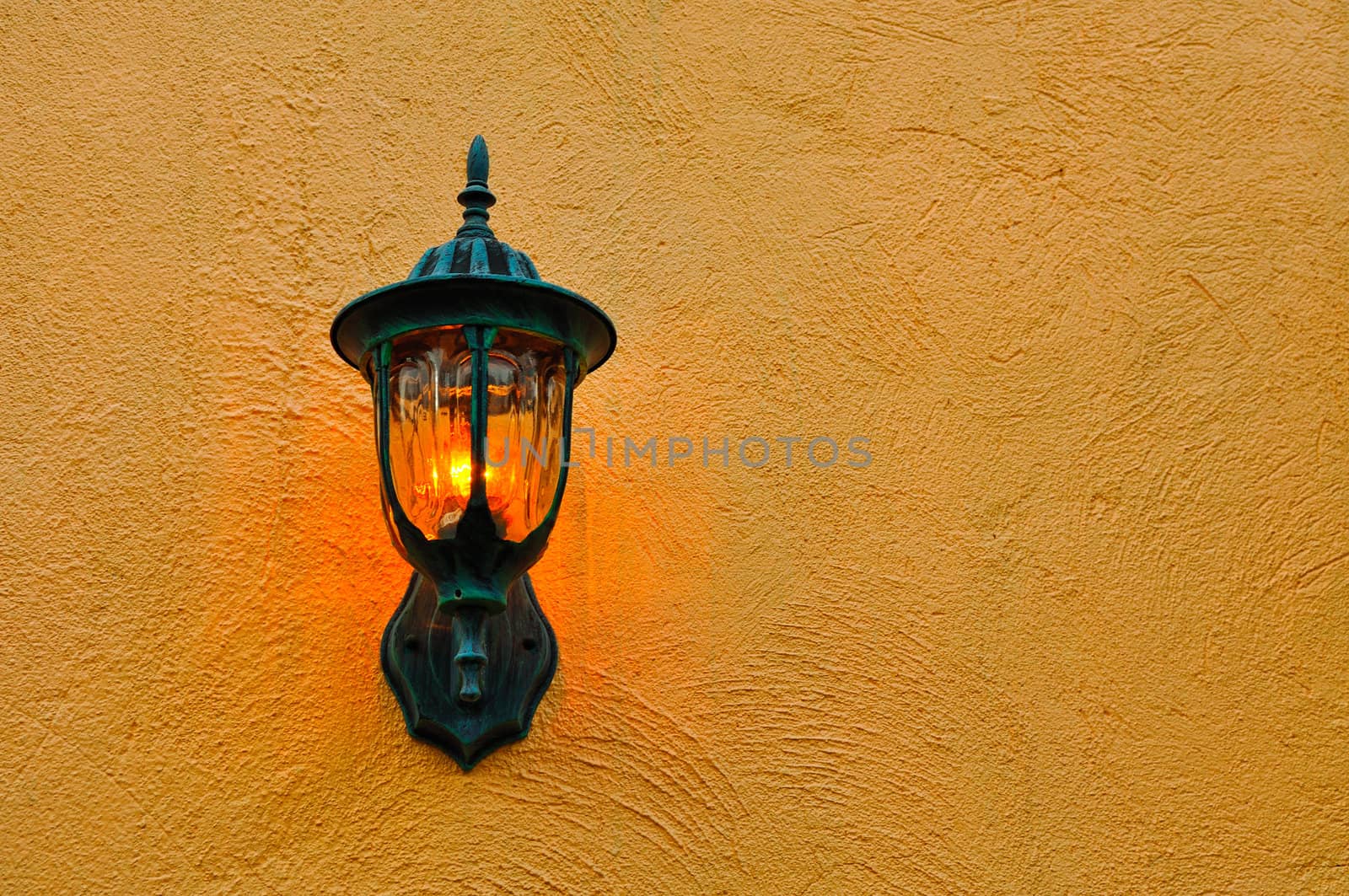 Beautiful outdoor wall lamp on a concrete wall
