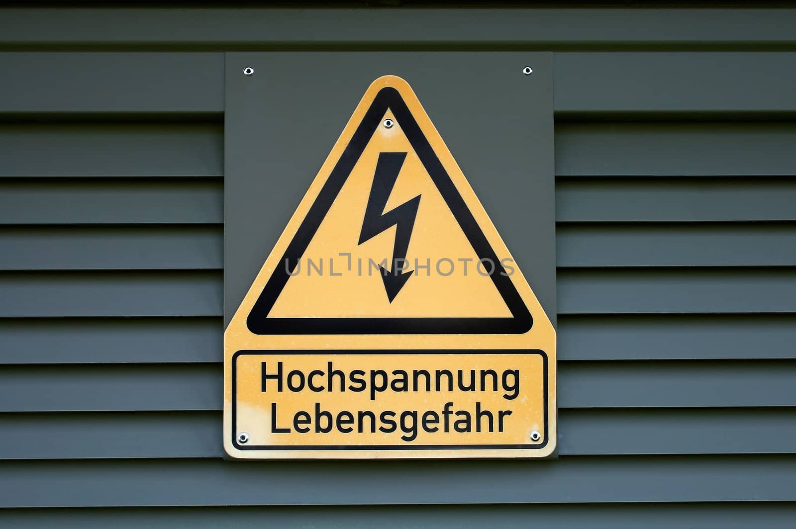 Sign on high electric voltage on a transformer box.