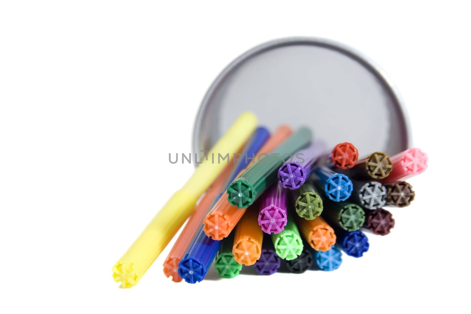 Markers lying in pencil holder isolated on white