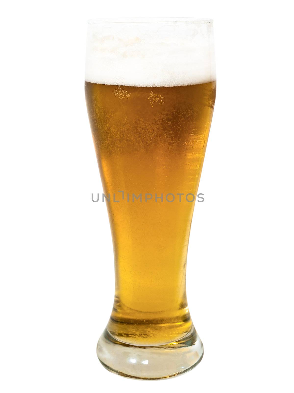 glass whith golden beer on the white surface