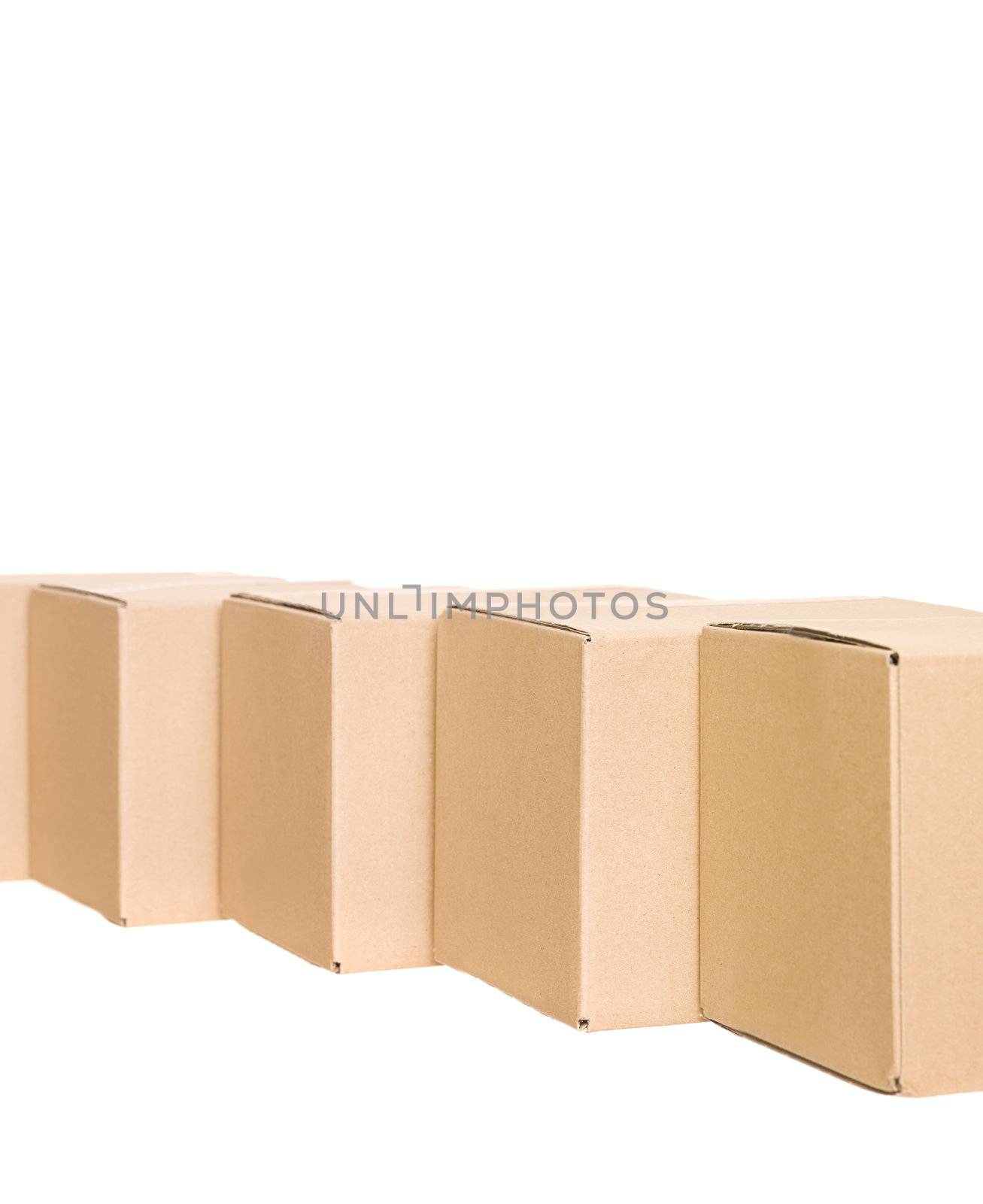 Cardboard boxes in a row isolated on white background