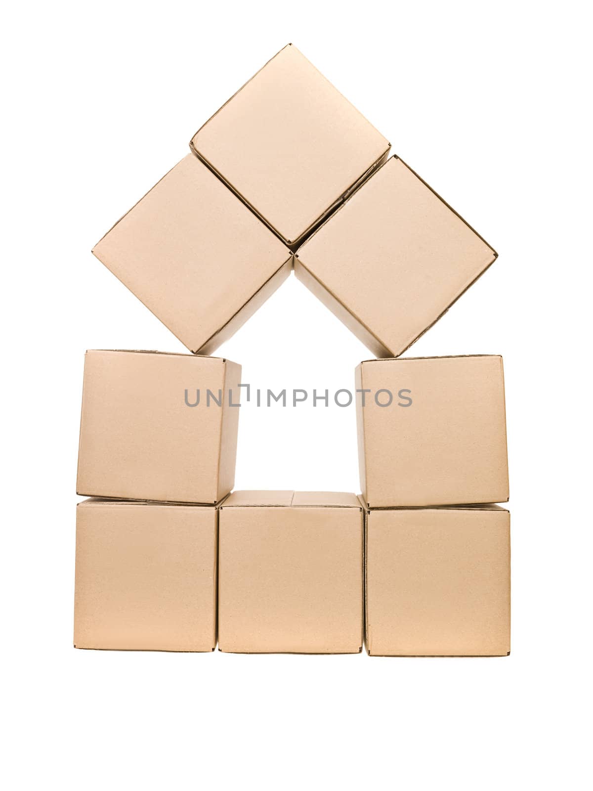 Cardboard boxes formed as a house isolated on white background