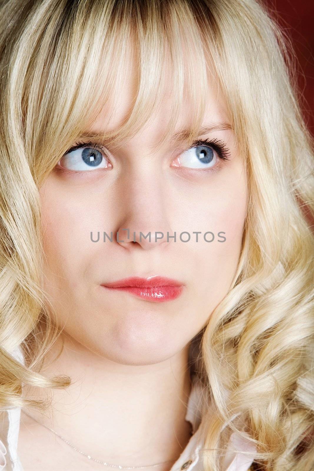 Portrait of the surprised girl with light hair
