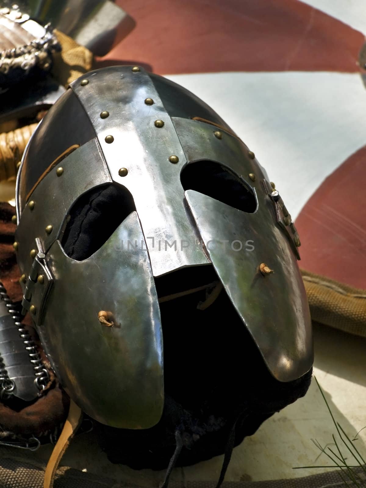 knight metal helmet over the stripped shield