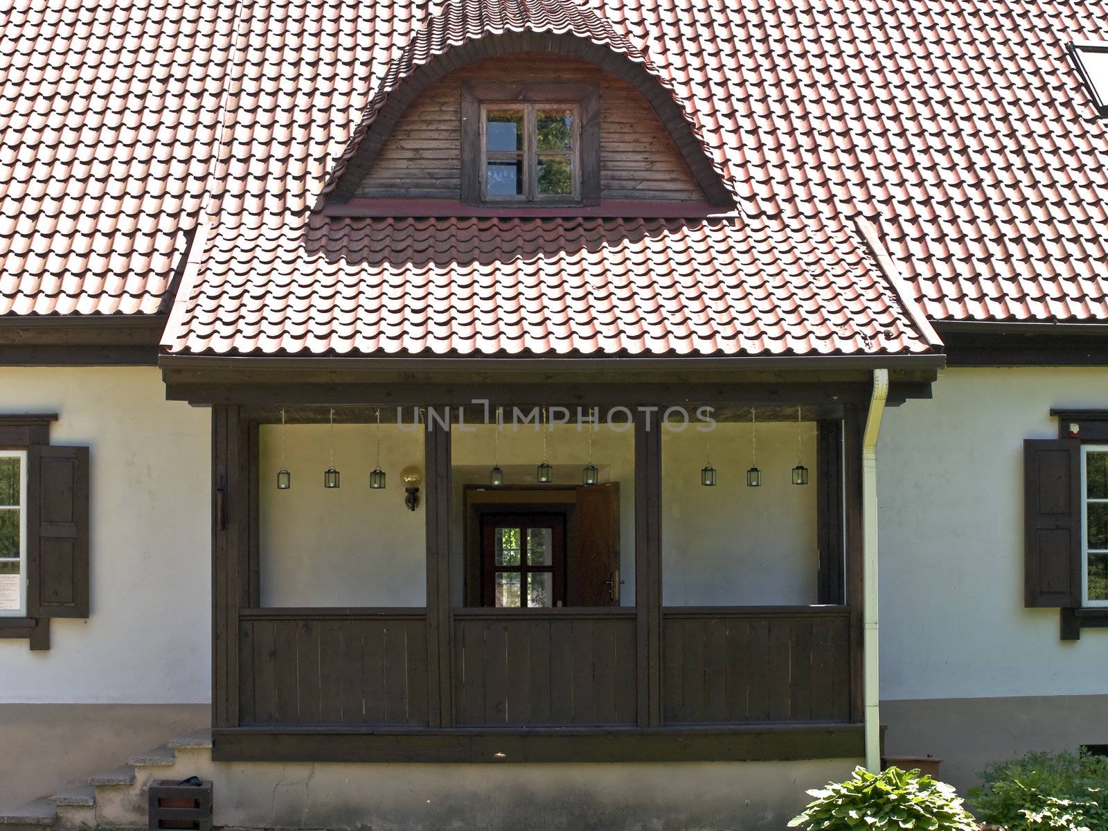 Nice white village house entrance with perron