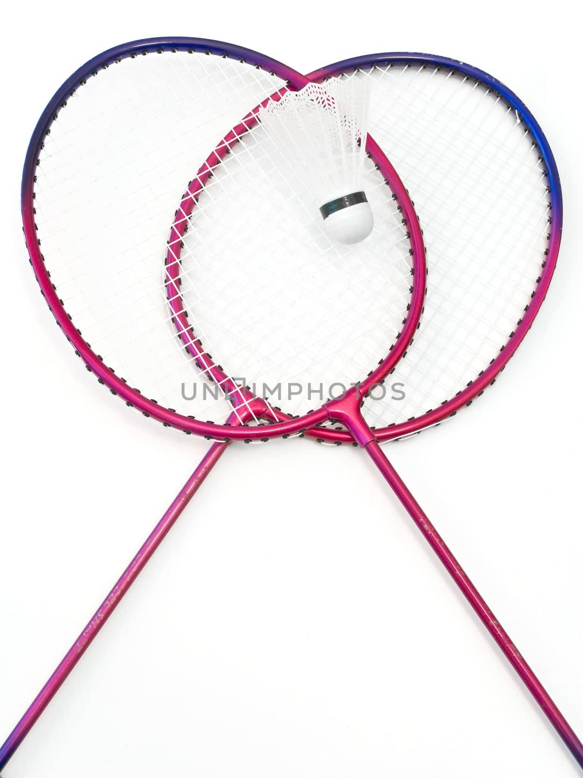 badminton rackets and shuttlecock at the white table 