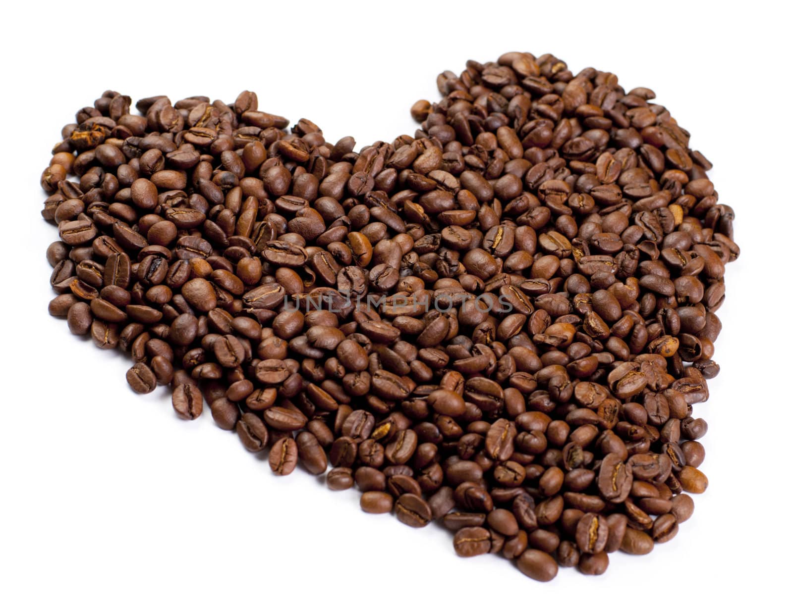 Heart made of coffee isolated on white background