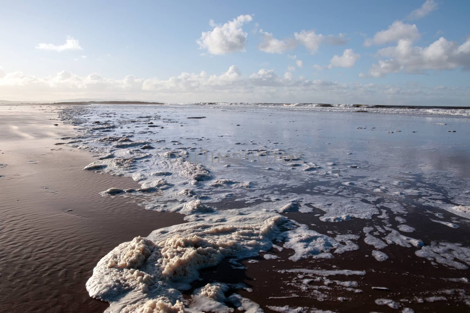 the waves crashing in on ballybunion beach ireland