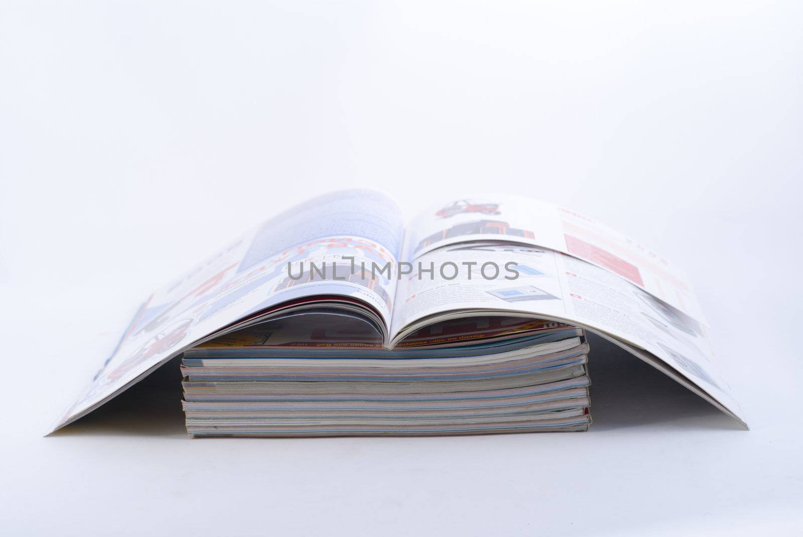 stack of colorful magazines or documents - paper edges background
