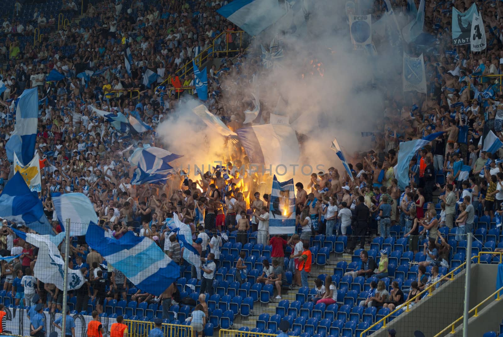 supporters burn flares