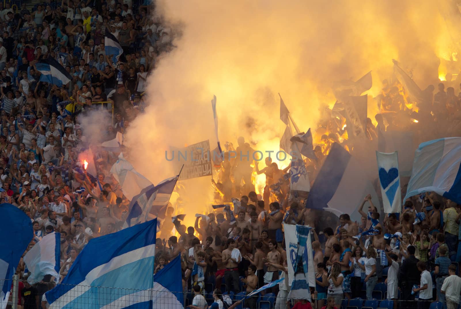 supporters burn flares