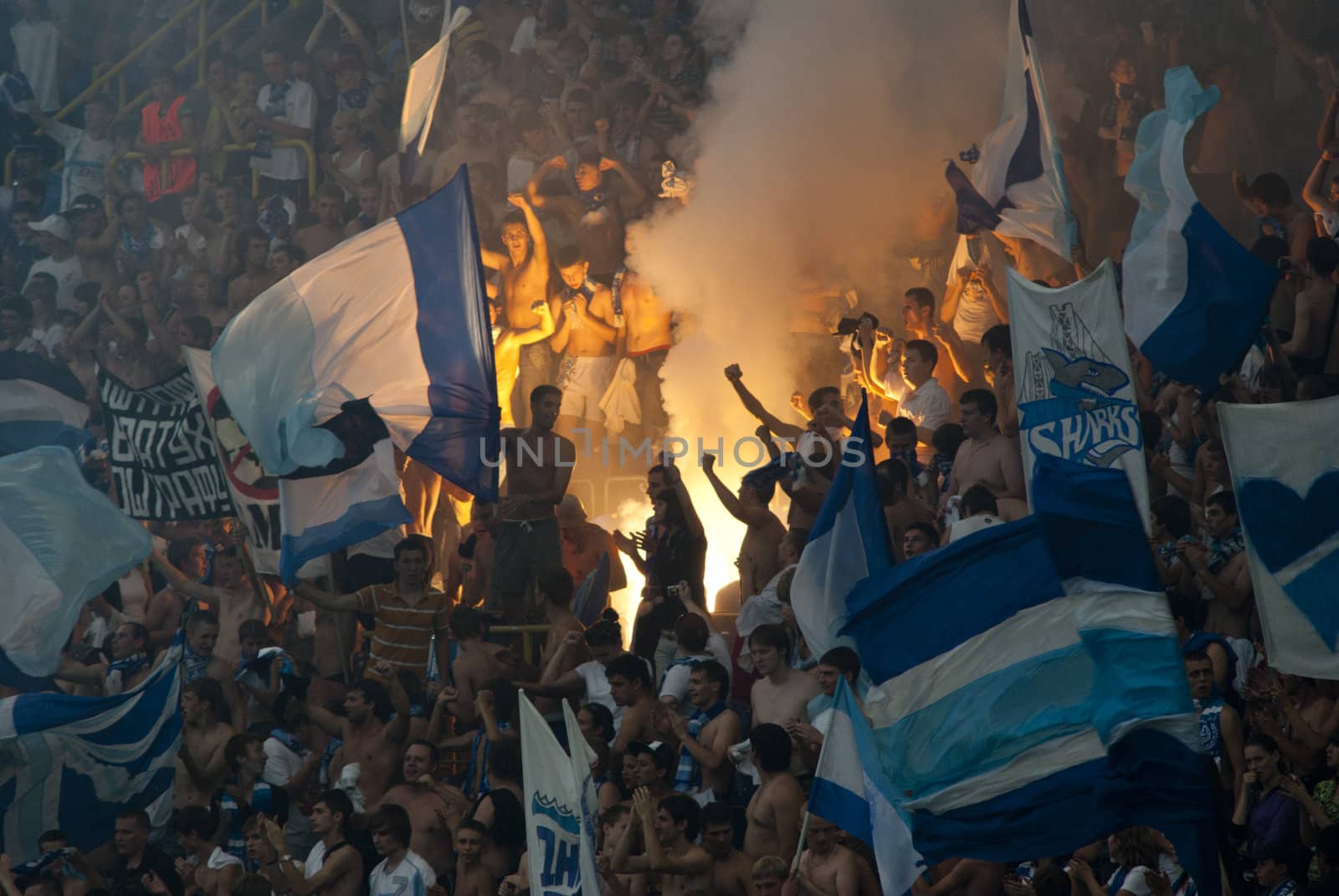 supporters burn flares