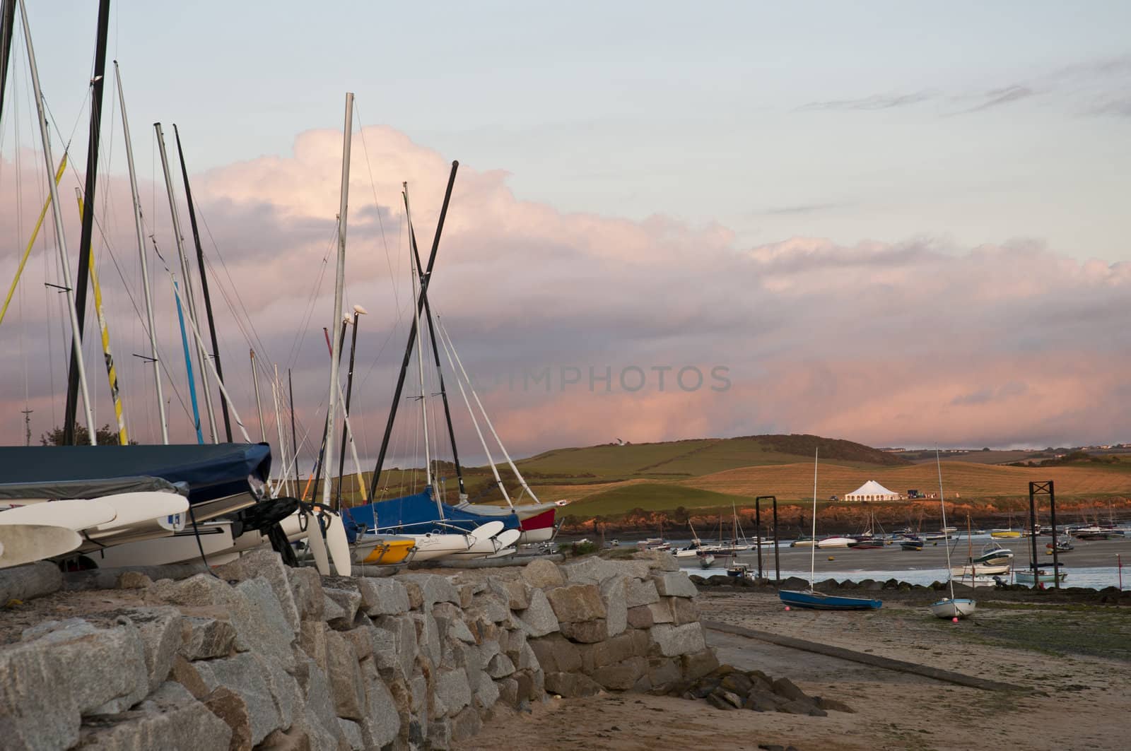 Detail shot of small docked vessels against evening sky in Rock, Cornwall, UK