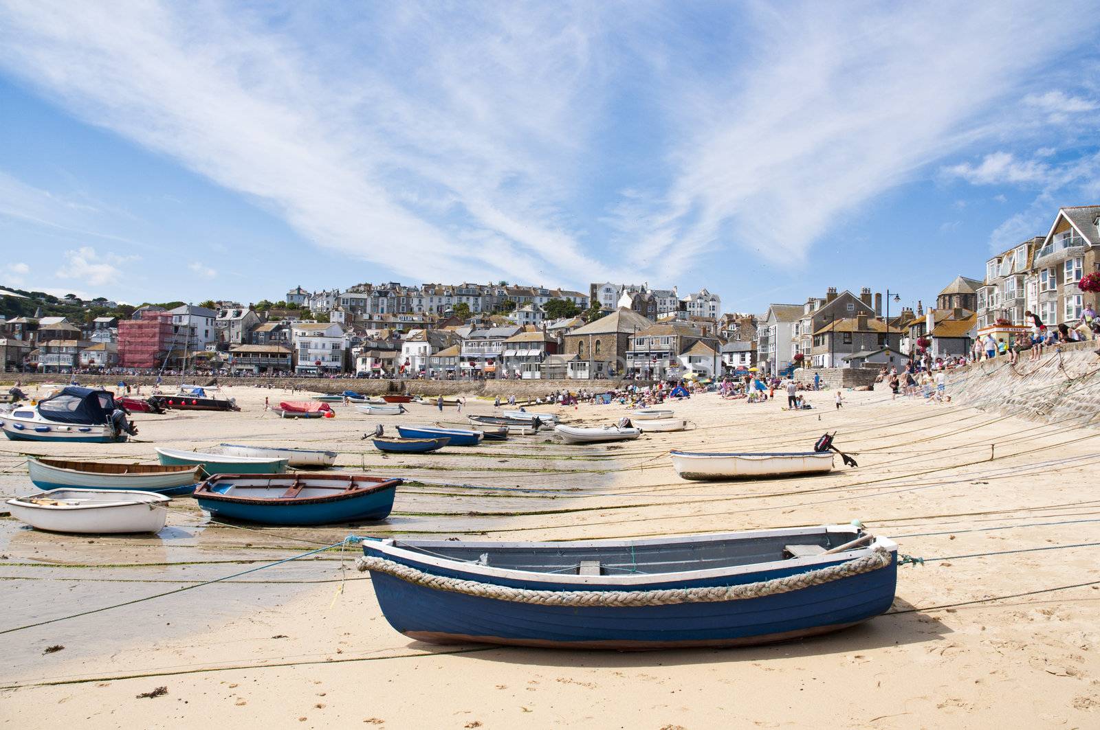 SAINT IVES, CORNWALL - AUGUST 8: Tourists and locals enjoy the beach during a low tide in St. Ives, in Cornwall, Southern UK August 8, 2010 in Saint Ives, Cornwall, UK.